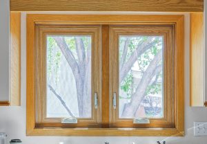 Wood-grain casement window in kitchen.